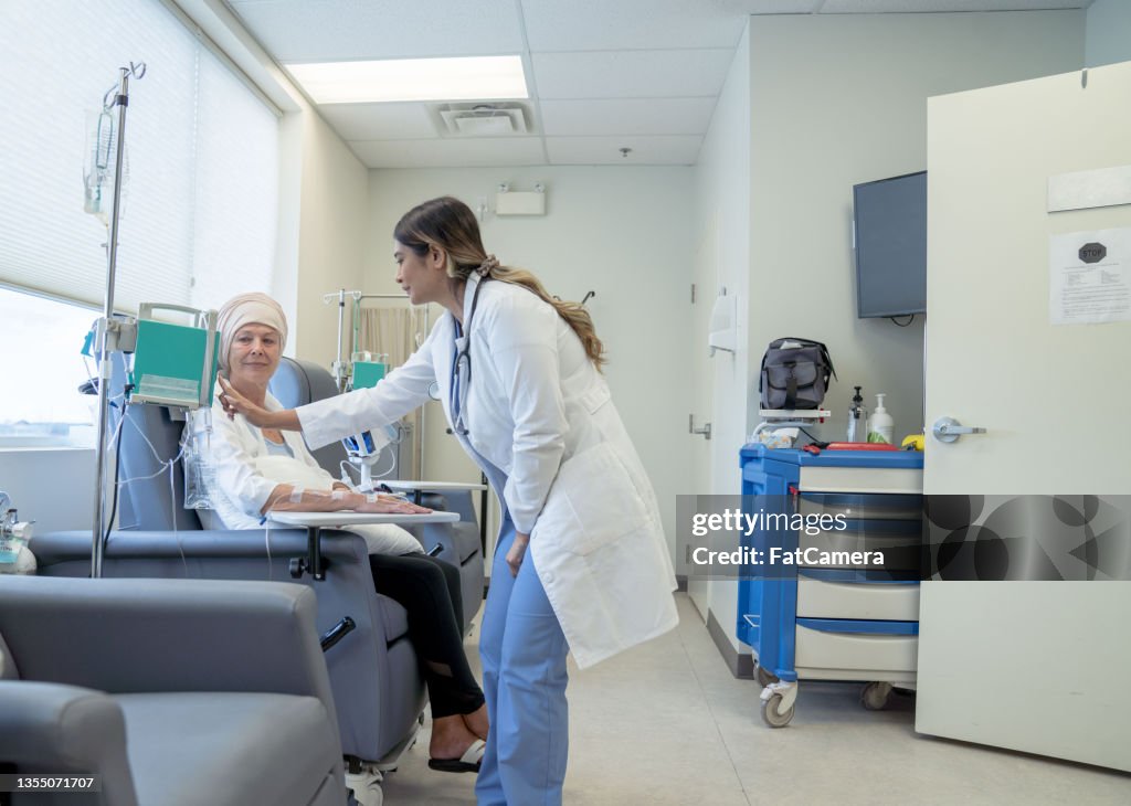 Doctor Changing a Chemotherapy Dosage