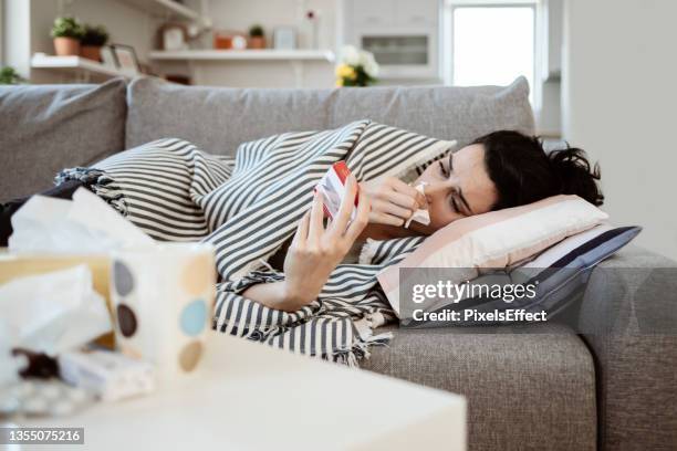 sick woman caught cold - respiratory infection stockfoto's en -beelden