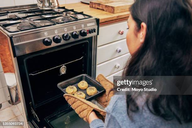 Putting Something In Putting Something In The Oven Photos and Premium High Res Pictures ...
