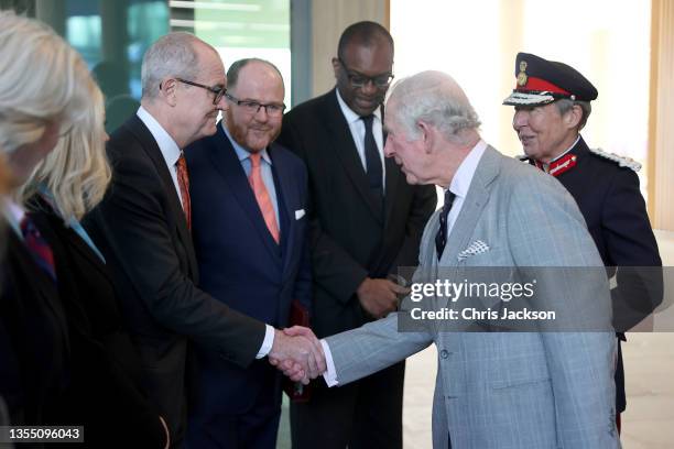 Prince Charles, Prince Of Wales is greeted by UK's Chief Scientific Advisor Patrick Vallance during a visit at the AstraZeneca global Research and...
