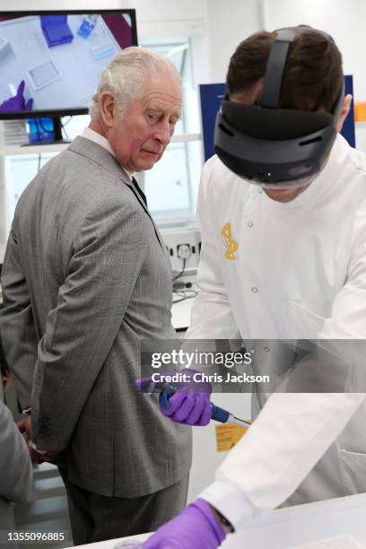 Prince Charles, Prince Of Wales, gets a demonstration of how augmented reality helps with Hololens technology during a visit at the AstraZeneca...