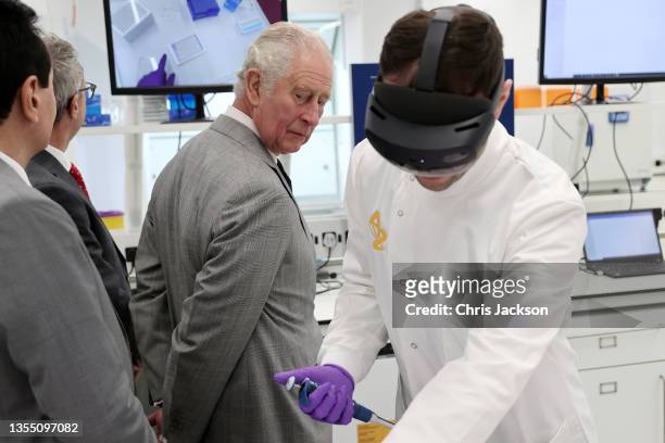 Prince Charles, Prince Of Wales, gets a demonstration of how augmented reality helps with Hololens technology during a visit at the AstraZeneca...