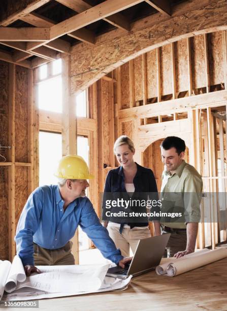 couple with home builder - residential construction stock pictures, royalty-free photos & images