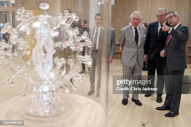 Prince Charles, Prince Of Wales is shown a Covid vaccine sculpture by artist Luke Jerram by CEO AstraZeneca Pascal Soriot Chairman AstraZeneca Leif...