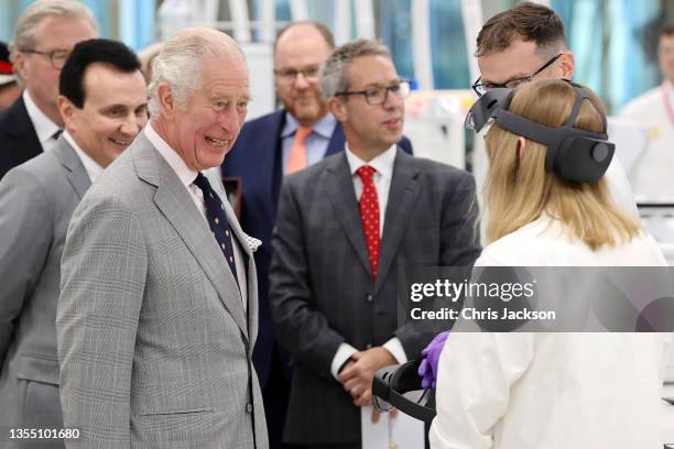 Prince Charles, Prince Of Wales, gets a demonstration of how augmented reality helps with Hololens technology during a visit at the AstraZeneca...