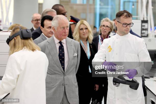 Prince Charles, Prince Of Wales, gets a demonstration of how augmented reality helps with Hololens technology during a visit at the AstraZeneca...