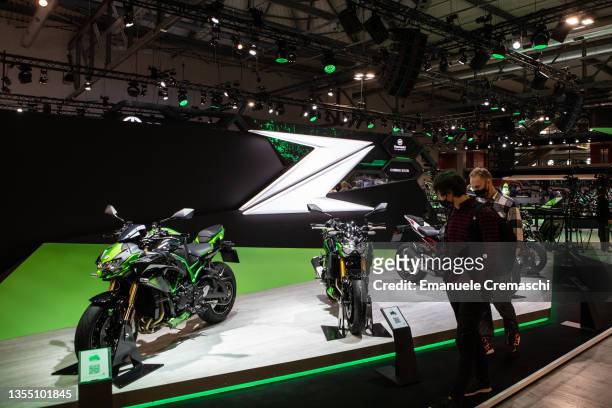 Fairgoers visit the stand of the Japanese motorcycle manufacturer Kawasaki during the 78th edition of EICMA on November 23, 2021 at Fiera Milano Rho...