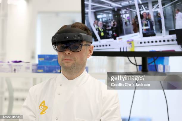 Scientist demonstrates how augmented reality helps with Hololens technology to Prince Charles, Prince Of Wales during a visit at the AstraZenaca...