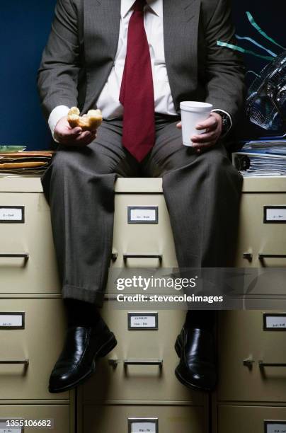 overweight businessman eating - fat guy eating donuts stock pictures, royalty-free photos & images
