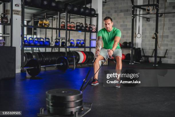 Man Straining As He Rows 43 Man Dragging Weights Stock Photos, High-Res Pictures, and Images ...