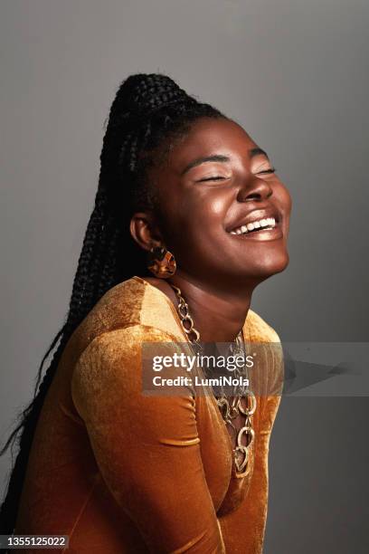 shot of a beautiful young woman posing against a grey background - makeup smile laugh closeup female stock pictures, royalty-free photos & images