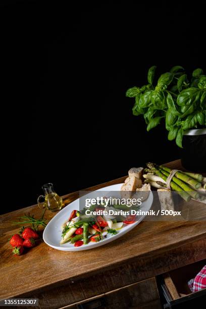 close-up of food on table against black background - gemüse grün stock pictures, royalty-free photos & images