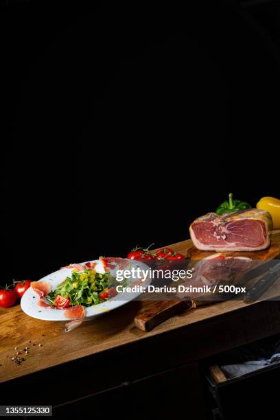 close-up of food on table against black background - blatt grün ストックフォトと画像
