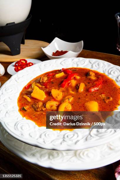 close-up of food in plate on table - soße stockfoto's en -beelden