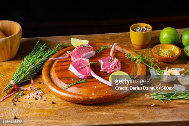 high angle view of food on cutting board - rosmarin weiss stockfoto's en -beelden