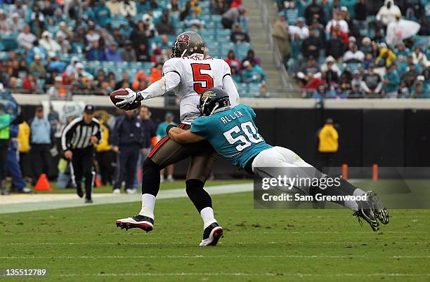Russell Allen of the Jacksonville Jaguars tackles Josh Freeman of the Tampa Bay Buccaneers during the game at EverBank Field on December 11, 2011 in...