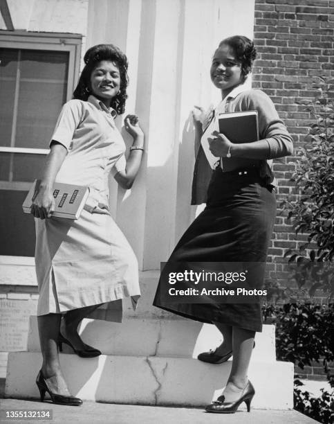 Two college students, Minnie Gadsden and Theola White, outside Coppin Hall at Allen University, Columbia, South Carolina, US, circa 1960.