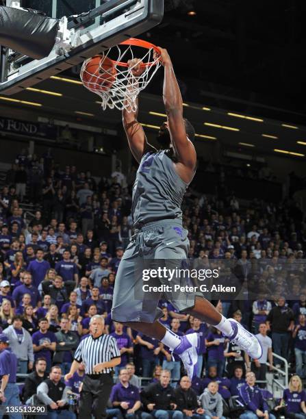 Forward Thomas Gibson of the Kansas State Wildcats dunks the ball against the North Florida Ospreys during the second half on December 11, 2011 at...