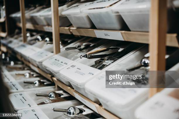 a selection of whole foods in bulk containers on shelf in package-free refill store. zero waste, plastic free, ecologically friendly, green living and sustainable lifestyle concept - homegrown produce stock photos et images de collection