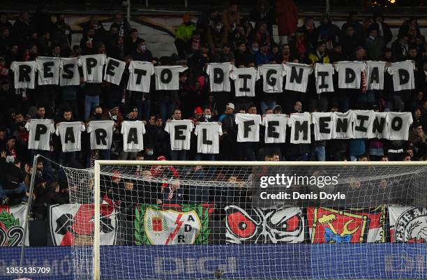 Rayo Vallecano supporters hold up shirts with a message which reads 'Respect and Dignity for the Women's Team' during the La Liga Santander match...