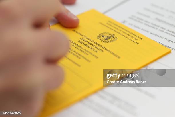 Medical personnel issues the vaccination certificate after she administers inoculations against Covid-19 at a drive-in vaccination center at the...