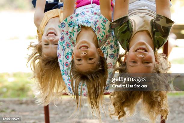 hanging blondes - girl upside down stock pictures, royalty-free photos & images