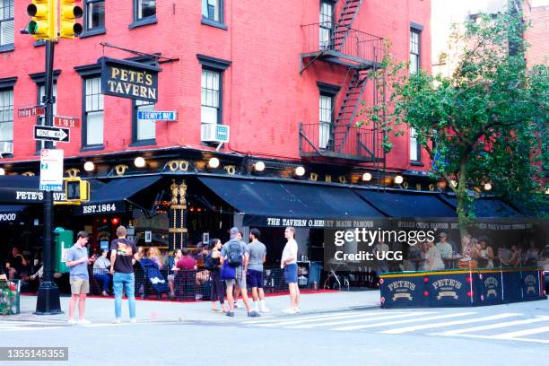 Large crowd outside Pete's Tavern as business returns with Covid 19 cases on the decline and vaccinations rising, New York City.