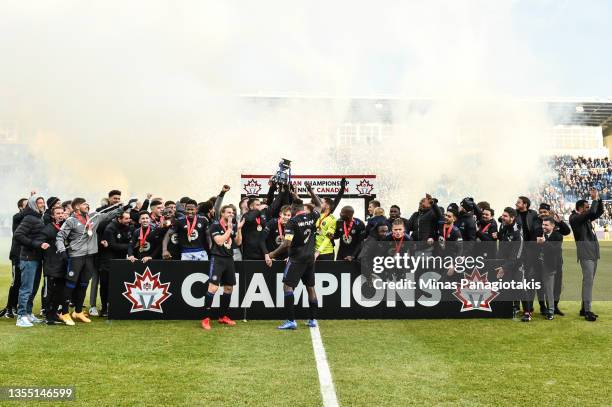 Members of CF Montréal celebrate with the Voyageurs Cup after being crowned the 2021 Canadian Champions with a 1-0 victory against Toronto FC at...