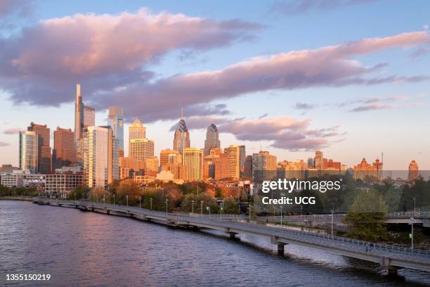 Skyline in autumn behind the Schuylkill River Boardwalk at Sunset, Philadelphia, Pennsylvania, USA.
