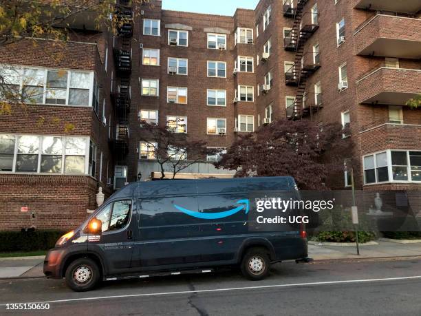 Amazon Prime delivery van outside apartment building, Queens, New York.