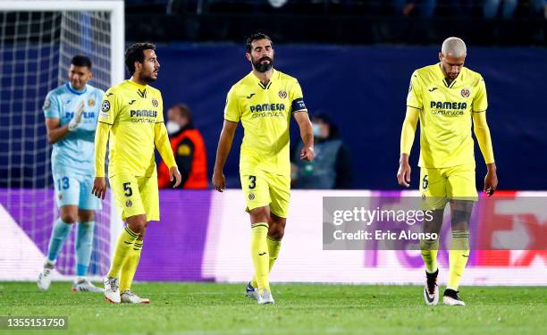 Daniel Parejo, Raul Albiol and Etienne Capoue of Villarreal CF look dejected after their side concedes a first goal scored by Cristiano Ronaldo of...