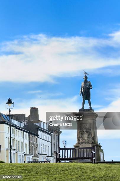 Statue of Captain James Cook with accompanying seagull on West Cliff at Whitby in north Yorkshire.
