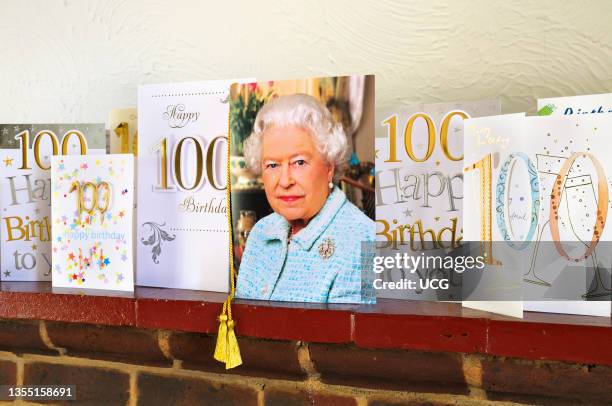 Queen's telegram proudly displayed on a mantelpiece with 100th birthday cards.