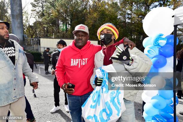 Radio personality Greg Street and recording artist Quavo of Migos attend the 2021 Quavo Cares Turkey Drive on November 23, 2021 in Atlanta, Georgia.