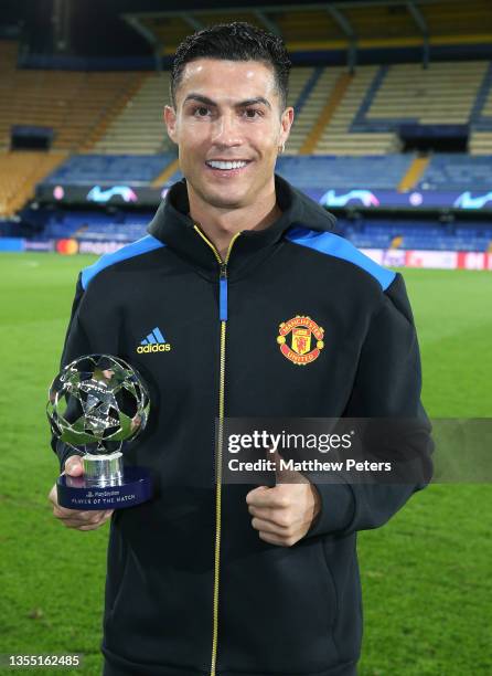 Cristiano Ronaldo of Manchester United poses with the Man of the Match award after the UEFA Champions League group F match between Villarreal CF and...