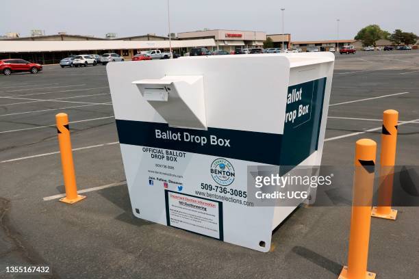 Official Benton County Washington ballot drop box in mall parking lot in Kennewick Washington, The parking lot of a shopping mall in Kennewick in...