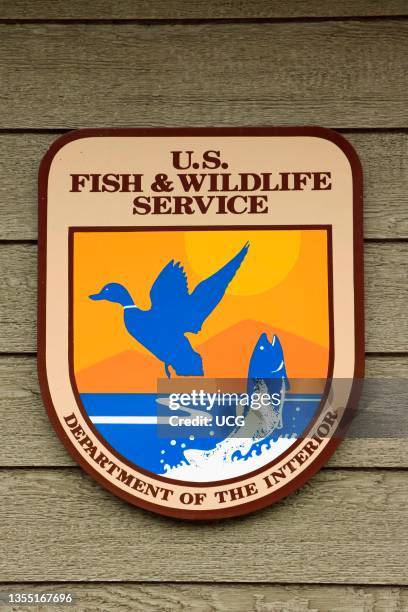 Fish and Wildlife Service logo on government building wall, The US Fish and Wildlife Service is part of the U.S. Department of Interior. This agency...