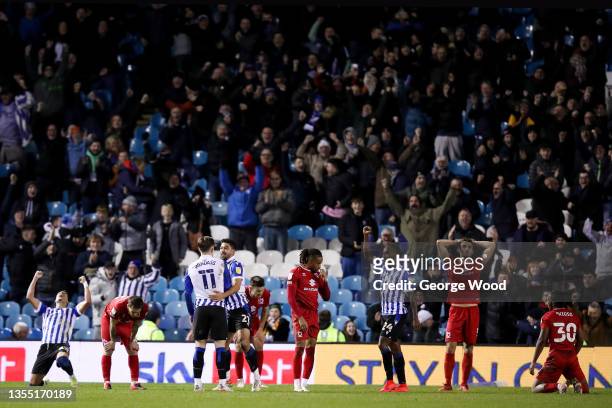 Josh Windass of Sheffield Wednesday celebrates with teammate Massimo Luongo after scoring their side's second goal as Warren O'Hora of Milton Keynes...