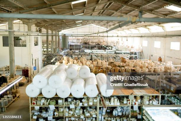 interior of a large ceramics manufacturing and storage warehouse - kitchenware shop stock pictures, royalty-free photos & images
