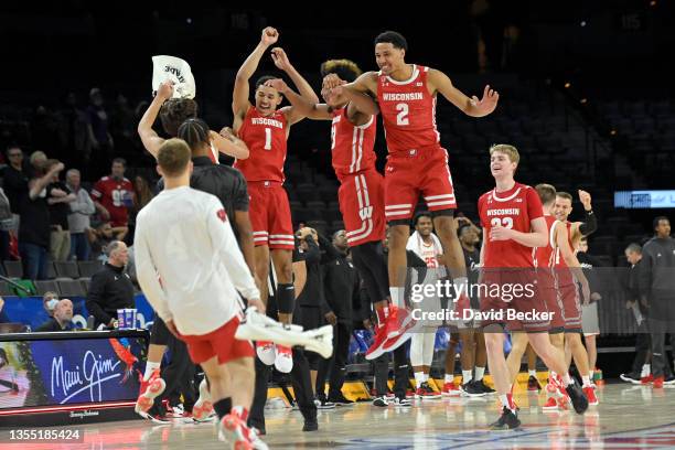 The Wisconsin Badgers celebrate their victory over the Houston Cougars during the 2021 Maui Invitational basketball tournament at Michelob ULTRA...