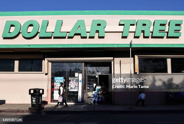 People walk past a Dollar Tree store on November 23, 2021 in Los Angeles, California. The company announced it will permanently increase prices from...