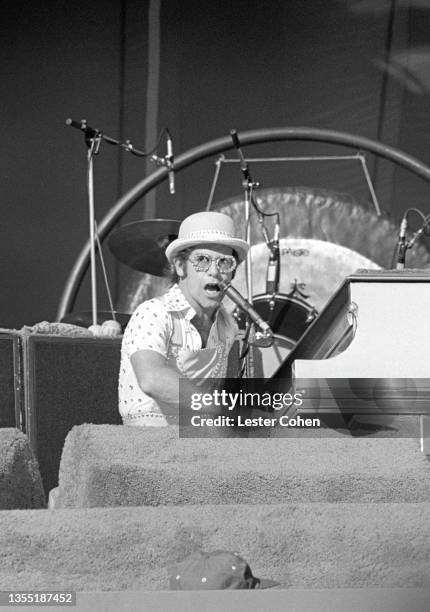 English singer, pianist and composer Elton John performs on stage during the West of the Rockies tour on October 25, 1975 at Dodger Stadium in Los...