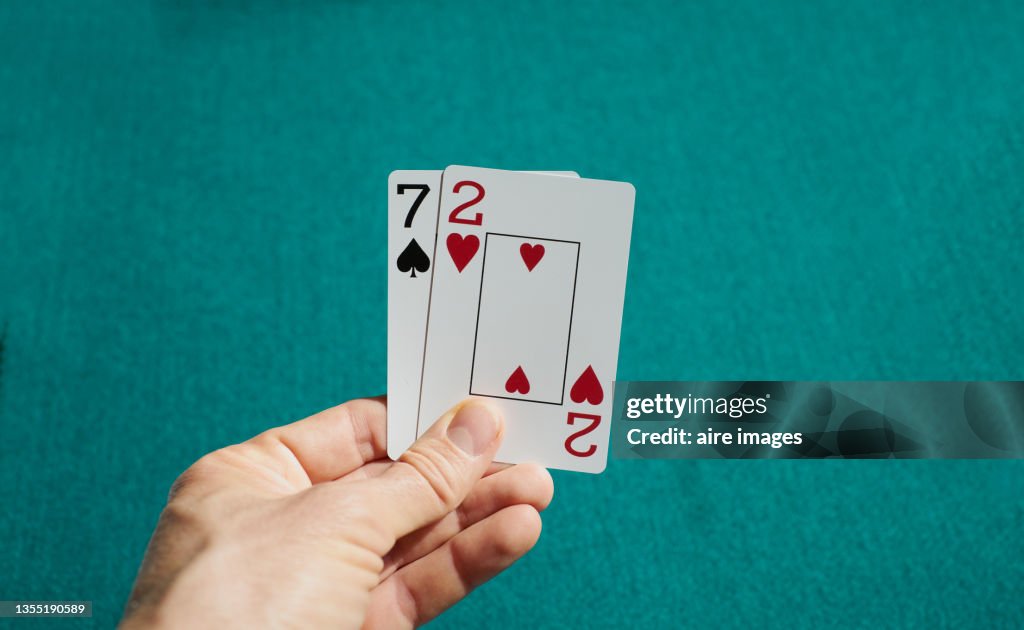 Closeup shot of playing cards held in a human hand
