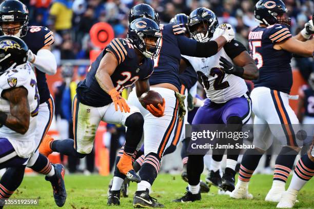 David Montgomery of the Chicago Bears runs with the ball against the Baltimore Ravens at Soldier Field on November 21, 2021 in Chicago, Illinois.