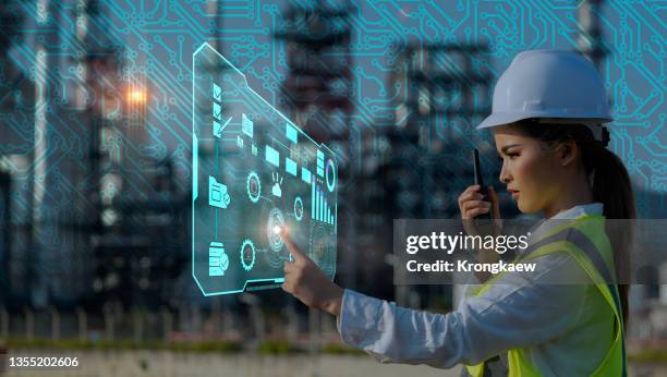 female industrial engineers using virtual analysis data of power plant station project on network metaverse. - technology revolution stock pictures, royalty-free photos & images