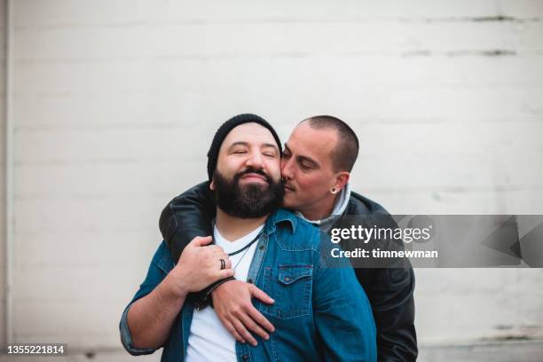 two affectionate men in love - hispanic gay man stock pictures, royalty-free photos & images