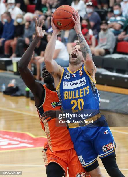 Nathan Sobey of the Brisbane Bullets and Majok Deng of the Cairns Taipans during the NBL Blitz match between the Cairns Taipans and the Brisbane...