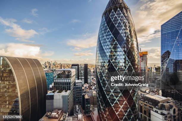 commercial skyscrapers in city of london - gherkin london stock pictures, royalty-free photos & images