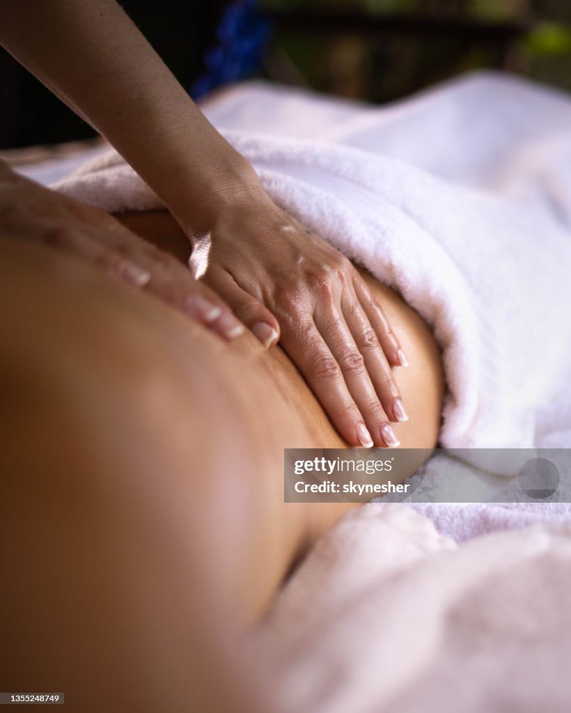 Close up of a back massage at the spa.