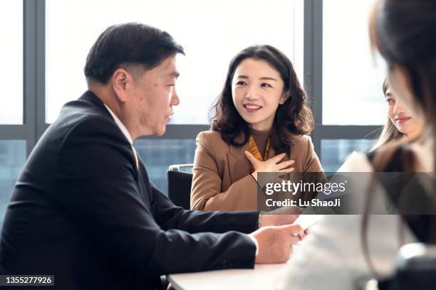 business colleagues discuss business plans in the office. - old shanghai stock pictures, royalty-free photos & images